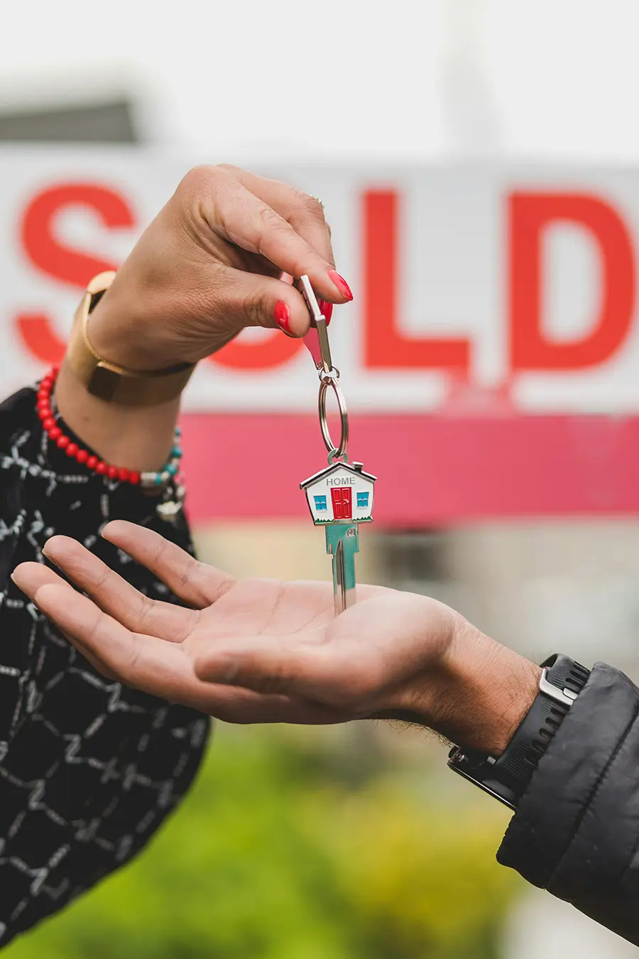 Happy family receiving keys to their new home